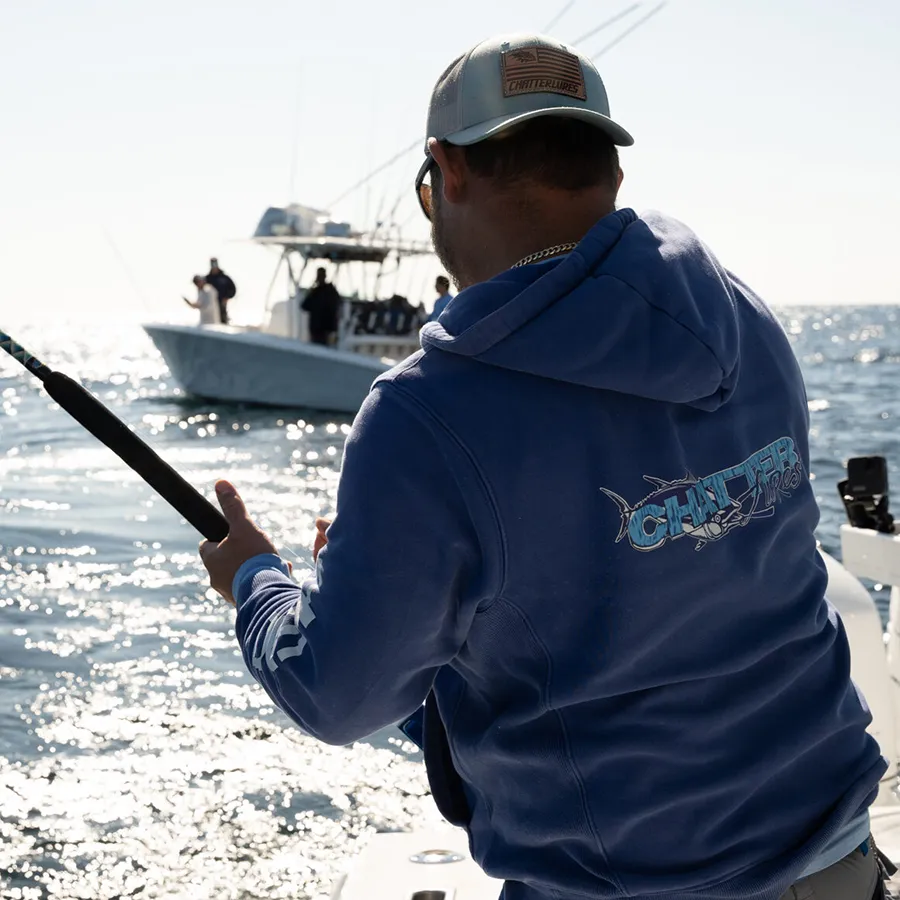 A man wearing ChatterLures apparel while fishing